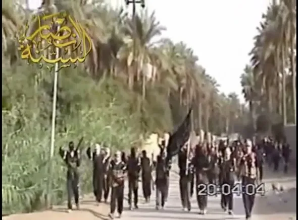 Ansar al-Sunnah insurgents parade through the streets.