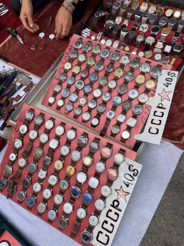A vendor sells Soviet-era watches off the street in Tashkent, Uzbekistan (Owen Schalk).