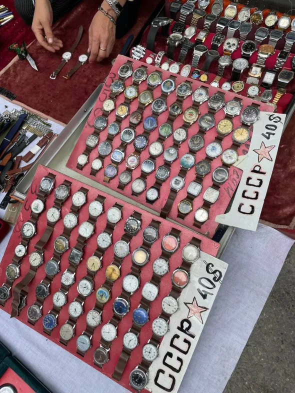 A vendor sells Soviet-era watches off the street in Tashkent, Uzbekistan (Owen Schalk).