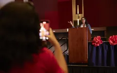 Nicholas-Weber-Rashida-Speaking-Member-Records-on-Phone-1024x683