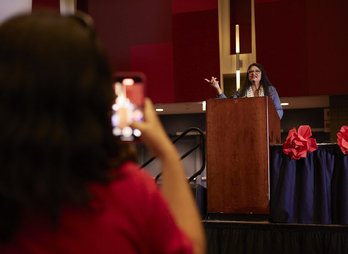 Nicholas-Weber-Rashida-Speaking-Member-Records-on-Phone-1024x683
