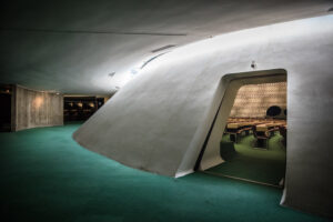 Interior of French Communist Party (PCF) headquarters building, view of inner hall looking into auditorium. Looks like a spaceship with green carpeting.